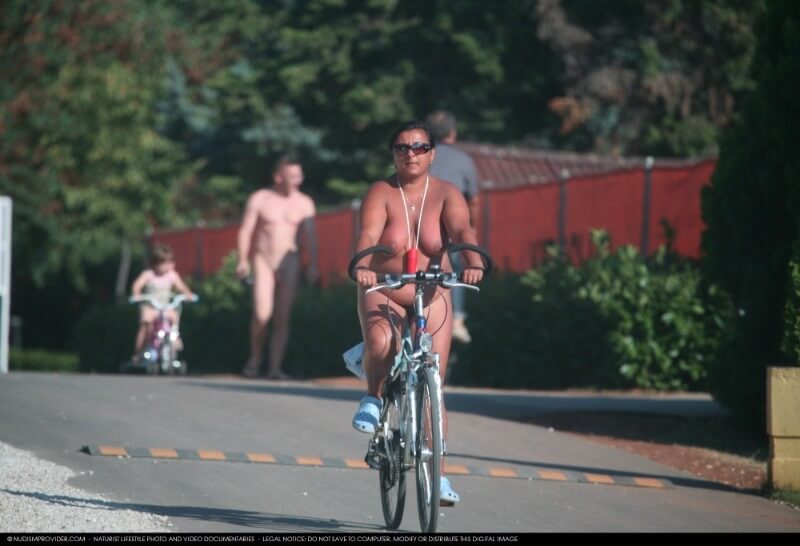 Naturists Road Biking pics - Growing up on a nude beach