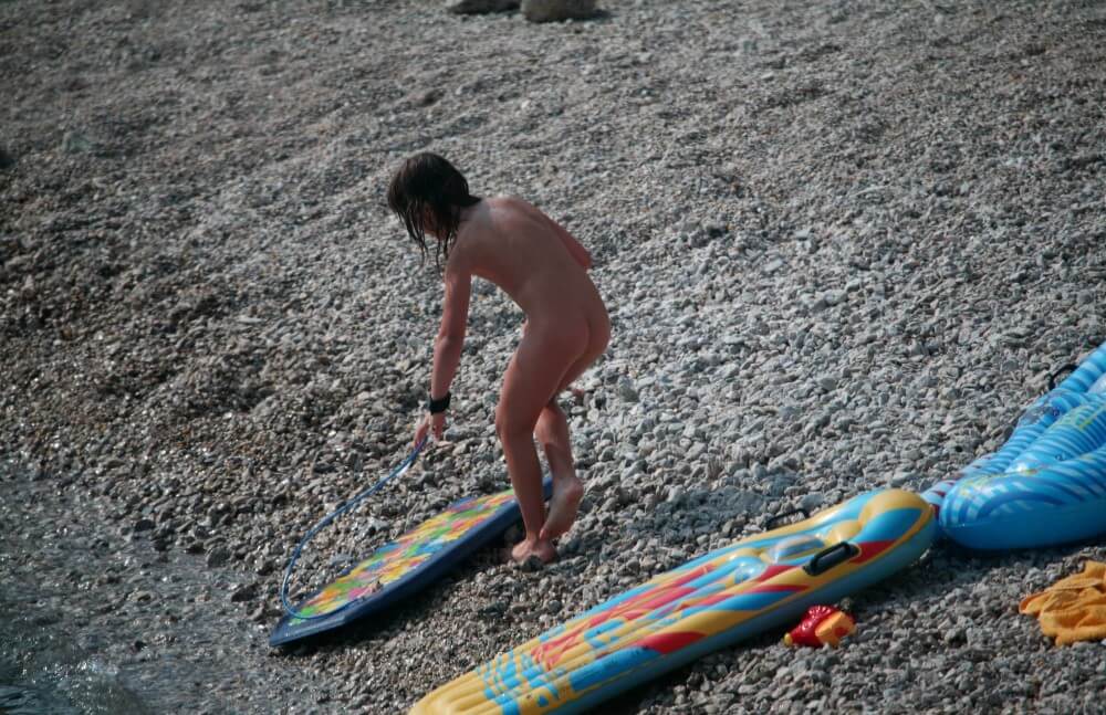 Naturist Surf Board Glides pics - Striving for tolerance and respect is the code of conduct among nudists