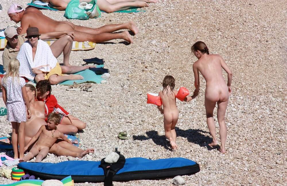 Orange Floaty Safety First Naturist pics - Nudism fosters trust and mutual understanding
